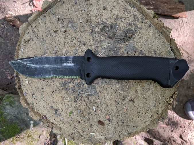 Camping knife on Tree Stump