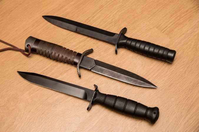 fight knives on a wooden background